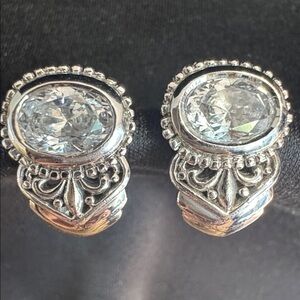 2 carat Oval CZ Huggie earrings. 
Fluer de lis & bead accent.
925 stamp